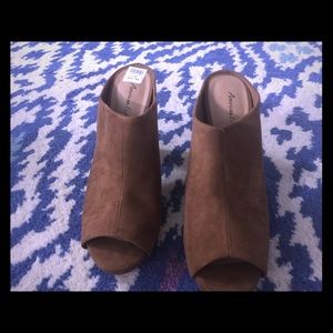 American Eagle brown suede mules.